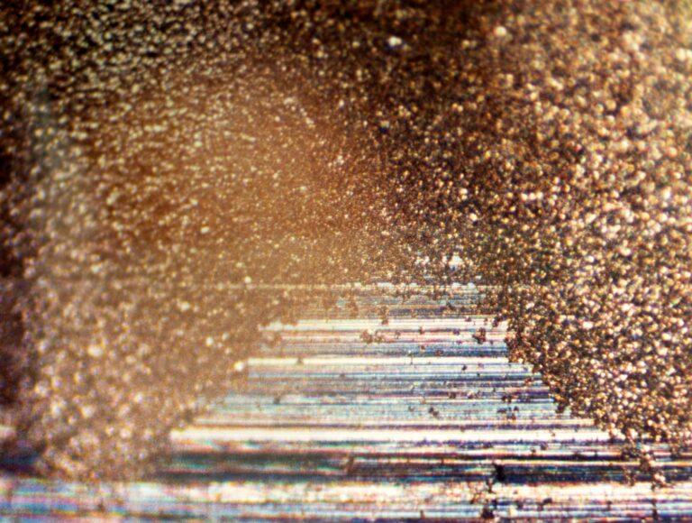 micrograph demonstrating characteristic washboard electrically induced bearing damage