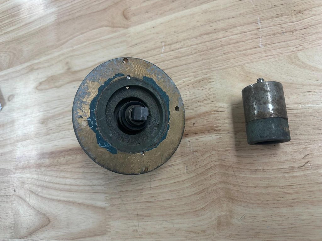 original SGS mounting assembly and grounding component before restoration